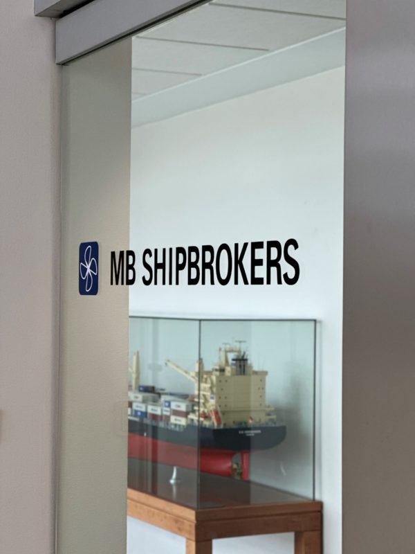 MB Shipbroker office sign on glass door